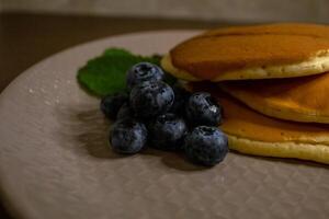Blueberry and condensed milk pancakes are the best solution for breakfast photo