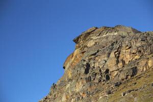 Rock cliff at the valley Karkevagge in Northern Sweden photo