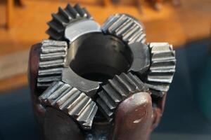 Drill bits. Perforator button for water wells. Tricone bit. Equipment for water and coal wells. Drilling photo