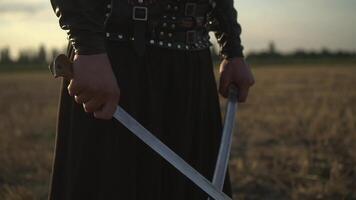 A Cossack with two sabres in his hands looks into the distance at the enemy 01 video