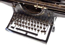 A detailed view of a Soviet-era Leningrad typewriter with Cyrillic keys and elegant retro design. A historical artifact showcasing craftsmanship and utility from mid-20th-century Russia photo