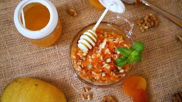 Cooked pumpkin porridge with rice, nuts and honey video