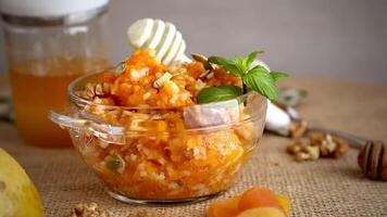 Cooked pumpkin porridge with rice, nuts and honey video