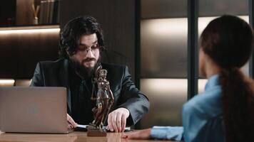 Caucasian male Lawyer holding document to read lawsuit and checking about financial business data while Protecting Client Innocents with Supporting Argument. Justice and law video