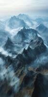 Majestic mountain landscape shrouded in mist and clouds photo