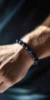 Stylish beaded bracelet on wrist in natural light photo