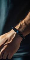 Stylish close-up of a bracelet worn on a hand in sunlight photo