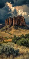 Majestic rock formation under dramatic stormy sky photo