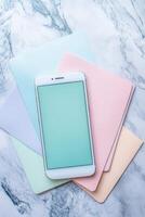 Smartphone placed on colorful pastel backgrounds photo