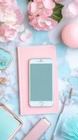 Elegant workspace featuring a smartphone and stationery photo