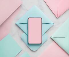 Flat lay of smartphone surrounded by colorful envelopes photo