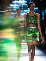 Fashion model showcases vibrant attire on runway photo