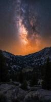 The milky way over the mountains in the distance photo