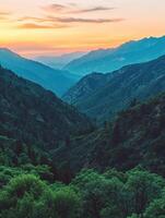 A beautiful view of the mountains at sunset photo