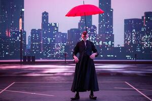 Mysterious Clown Performer with Red Umbrella in Urban Nightscape. photo