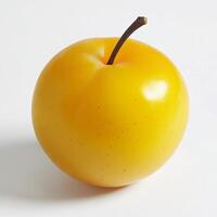 A yellow apple on a white surface photo
