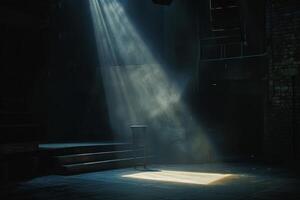 A stage with a spotlight shining on a microphone photo