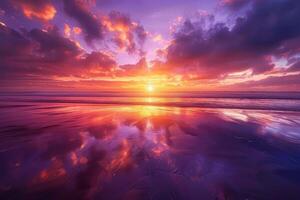 A sunset over the ocean with clouds reflected in the water photo