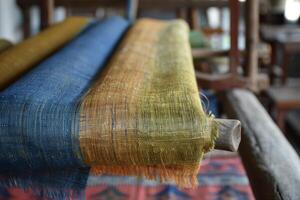 A loom with several colorful cloths on it photo