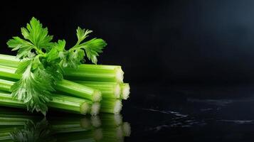 Fresh celery on black background photo