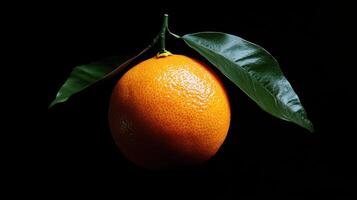 An orange with green leaves photo