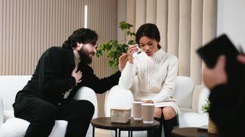 A married couple discussing their problems at a counseling session with a psychologist. Concept of psychological support in solving family problems and improving relationships video