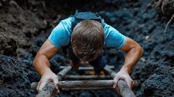 A man climbing up a wooden ladder photo
