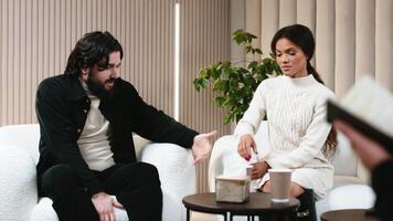 Couple at a counseling session with a psychologist shares the results of their success. Concept of successful restoration of multiracial relationships through professional and psychological counseling video
