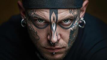 A man with tattoos on his face photo