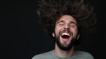 A man with long hair and a beard is laughing photo