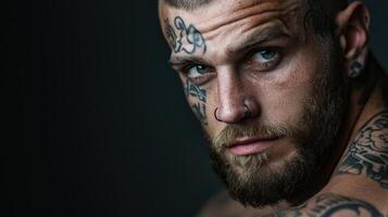A man with tattoos on his face and chest photo
