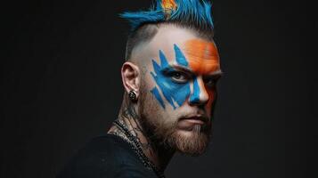 A man with blue and orange hair and a face paint photo