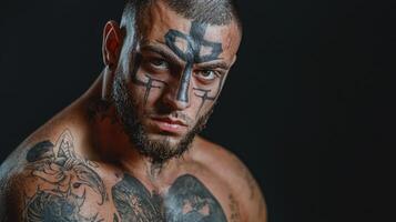 A man with tattoos on his face photo