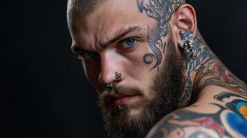 A man with tattoos on his face and chest photo