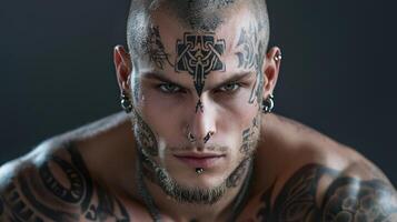 A man with tattoos on his face photo