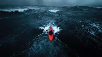A kayaker in the middle of a large ocean photo