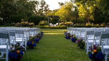 An outdoor ceremony with chairs and flowers photo