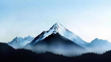 A mountain range with a large peak in the middle photo