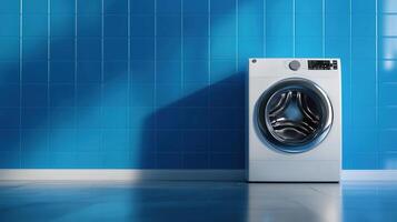 A washing machine in front of a blue wall photo