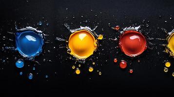 A series of colorful drops of paint on a black background photo