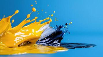A splash of yellow and blue paint on a blue background photo
