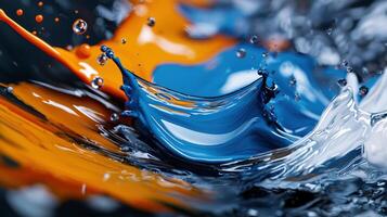 A splash of paint in the water with a splash of blue and orange photo