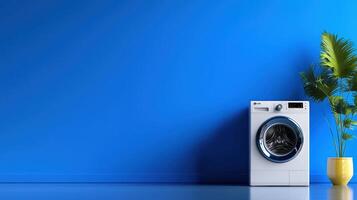 A washing machine and a plant in front of a blue wall photo