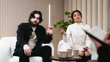 Therapy session, a serious family couple seeks support and consulting from a psychologist to address and resolve underlying problems. Positive impact of psychotherapy in resolving family issues video