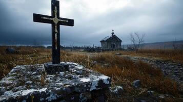 A cross is standing on a stone slab in a field photo