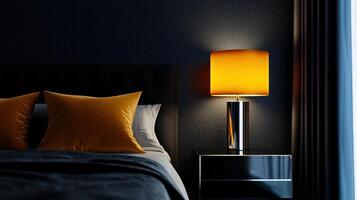 A bedroom with a black bed and a lamp on a nightstand photo