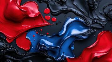 A red, blue and black background with paint splashes photo