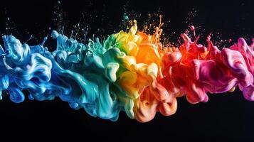 Colorful ink splash on black background photo