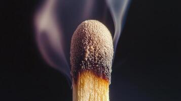 A matchstick with smoke coming out of it photo