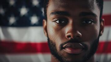 A man with a beard and an american flag in the background photo
